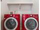 Well-lit laundry room is equipped with a side-by-side washer and dryer for your convenience at 6519 Eastview St, Longmont, CO 80504
