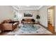 Cozy living room featuring hardwood floors, stylish furniture, and bright natural light at 6519 Eastview St, Longmont, CO 80504