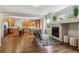 Open-concept living space with a fireplace and view into the spacious kitchen at 6519 Eastview St, Longmont, CO 80504