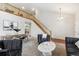 Spacious living room featuring tall ceilings, staircase, and contemporary decor at 6519 Eastview St, Longmont, CO 80504