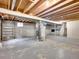 Unfinished basement featuring exposed beams and mechanical equipment at 8546 E Mineral Cir, Centennial, CO 80112