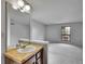 Half bathroom featuring a sink with vanity, natural light, and a view of the living room at 8546 E Mineral Cir, Centennial, CO 80112