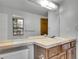 Bathroom with a large mirror over the sink and a window providing natural light at 8546 E Mineral Cir, Centennial, CO 80112