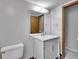 Bathroom featuring a marble vanity, modern fixtures, and a neutral color palette at 8546 E Mineral Cir, Centennial, CO 80112