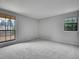 Bedroom boasts dual windows that offer bright, natural lighting and scenic outdoor views at 8546 E Mineral Cir, Centennial, CO 80112