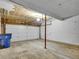 This garage features a two-car white door and concrete flooring at 8546 E Mineral Cir, Centennial, CO 80112