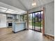 Bright kitchen features light blue cabinets, stainless steel appliances, and a sliding glass door to the backyard at 8546 E Mineral Cir, Centennial, CO 80112