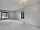 Bright living room featuring neutral paint, plush carpet, with windows offering natural light at 8546 E Mineral Cir, Centennial, CO 80112