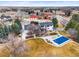 Aerial view showcasing the property's pool, manicured backyard, lush landscaping, and charming neighborhood setting at 7829 Nile Cir, Arvada, CO 80007
