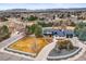 Aerial view of a home with large yard, white fence and an attached garage at 7829 Nile Cir, Arvada, CO 80007