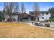 Large backyard features a hot tub, patio seating, pool area, and mature trees, perfect for outdoor living at 7829 Nile Cir, Arvada, CO 80007