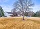 Expansive backyard featuring a hot tub, patio with seating, covered pool, and mature landscaping at 7829 Nile Cir, Arvada, CO 80007