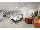 Finished basement includes a seating area and neutral carpeting with recessed lighting at 7829 Nile Cir, Arvada, CO 80007