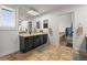 Bathroom featuring a large vanity with dual mirrors and a soaking tub in a separate alcove at 7829 Nile Cir, Arvada, CO 80007