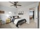 Bedroom with contemporary design, neutral color scheme, and an open doorway to another room at 7829 Nile Cir, Arvada, CO 80007