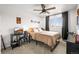 Bedroom with modern desk setup, neutral color scheme, and window views at 7829 Nile Cir, Arvada, CO 80007