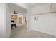 Bedroom showcasing an open doorway to a main bedroom with a fireplace at 7829 Nile Cir, Arvada, CO 80007