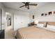 Bedroom featuring striped bedding, neutral color scheme, and window views at 7829 Nile Cir, Arvada, CO 80007