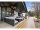 Inviting covered patio features a ceiling fan, comfortable seating, and a cozy fire table for relaxing outdoors at 7829 Nile Cir, Arvada, CO 80007