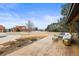 Inviting covered porch featuring stamped concrete, comfortable seating, and views of the front yard at 7829 Nile Cir, Arvada, CO 80007