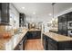 Spacious kitchen features granite counters, stainless appliances, and two large islands at 7829 Nile Cir, Arvada, CO 80007