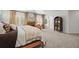 Spacious main bedroom featuring a cozy fireplace, neutral décor, and carpeted floors at 7829 Nile Cir, Arvada, CO 80007