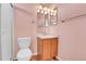 Bathroom features nice fixtures, a mirror, and a toilet at 20764 E 47Th Ave, Denver, CO 80249