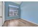 Bedroom with a large window letting in lots of natural light and beautiful vinyl wood flooring at 20764 E 47Th Ave, Denver, CO 80249