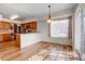 Bright dining area with natural light and an adjacent kitchen, and access to patio at 20764 E 47Th Ave, Denver, CO 80249