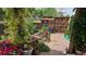 Charming garden with vibrant flowers and a wooden fence creates a delightful outdoor oasis at 20764 E 47Th Ave, Denver, CO 80249