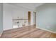 Upstairs hallway with wood floors and views to the main level of the house at 20764 E 47Th Ave, Denver, CO 80249