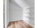 Spacious walk-in closet with wood floor and wire shelving for optimal storage at 20764 E 47Th Ave, Denver, CO 80249