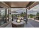 A cozy back deck with a fire pit, offering scenic views and a perfect spot for outdoor gatherings at 3254 Red Tree Pl, Castle Rock, CO 80104