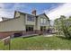 Home featuring large windows, a brick chimney, and an inviting outdoor deck at 3254 Red Tree Pl, Castle Rock, CO 80104