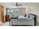 Relaxing bedroom with a ceiling fan and a lovely window view at 3254 Red Tree Pl, Castle Rock, CO 80104