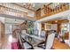 Spacious dining room with hardwood floors, a staircase, and an open floor plan to a comfortable seating area at 3254 Red Tree Pl, Castle Rock, CO 80104