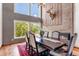 Formal dining room featuring a fireplace, large windows with a scenic view, and contemporary décor at 3254 Red Tree Pl, Castle Rock, CO 80104