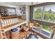 Foyer with hardwood floors, an elegant chandelier, and a view to a living room with natural light at 3254 Red Tree Pl, Castle Rock, CO 80104