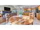 Spacious open-concept area featuring a dining table with combined living room and kitchen at 3254 Red Tree Pl, Castle Rock, CO 80104