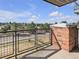 Balcony view overlooking a neighborhood with trees and walking trails on a bright day at 9019 E Panorama Cir # D217, Englewood, CO 80112