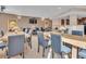 Well-lit dining area with multiple tables and chairs, perfect for community gatherings and events at 9019 E Panorama Cir # D217, Englewood, CO 80112