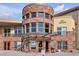 Architecturally interesting brick building with numerous windows and modern awning at 9019 E Panorama Cir # D217, Englewood, CO 80112