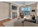 Bright living room with fireplace, TV, and balcony access offers a relaxing and modern living space at 9019 E Panorama Cir # D217, Englewood, CO 80112