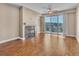 Sun-filled living room featuring hardwood floors, a fireplace, and access to a balcony with great views at 9019 E Panorama Cir # D217, Englewood, CO 80112