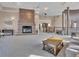 Spacious lobby with a brick fireplace, comfortable seating, and access to the upper level at 9019 E Panorama Cir # D217, Englewood, CO 80112