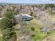 Areal view of home with a backyard featuring mature trees, lush lawn, and trampoline at 5752 S Jasmine St, Greenwood Village, CO 80111