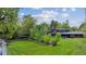Expansive backyard with lush greenery and a charming home at 5752 S Jasmine St, Greenwood Village, CO 80111