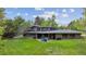 Lush backyard featuring a beautiful home, patio seating, and verdant lawn at 5752 S Jasmine St, Greenwood Village, CO 80111