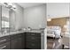 Bathroom with dual sink vanity, granite countertops, and neutral color palette at 5752 S Jasmine St, Greenwood Village, CO 80111
