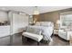 Spacious main bedroom boasts neutral decor, dark floors, and ample natural light at 5752 S Jasmine St, Greenwood Village, CO 80111